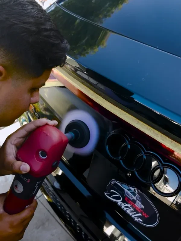 Drew detailing an Audi with a polishing machine